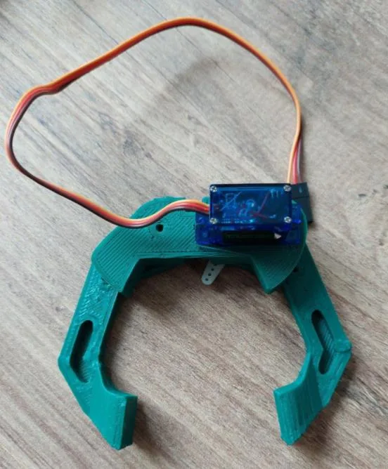 The 3D-printed gripper with its servo mounted